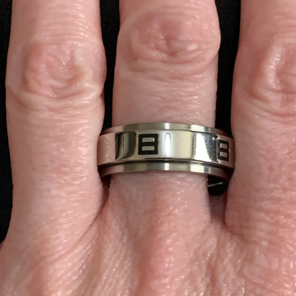 Silver tone and black spinner ring size 10